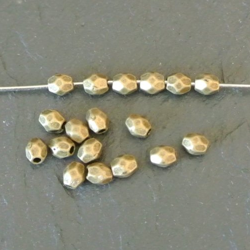 100 petites perles intercalaires bronze ovales ou olives à facettes, 3 x 4 mm