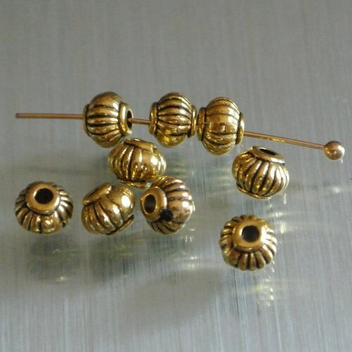 30 petites perles intercalaires dorées, forme lanterne 5 mm en métal doré strié, trou : 1,5 mm environ