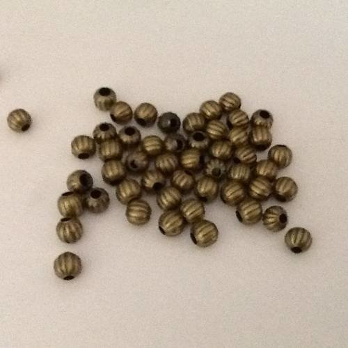 25 perles rondes ondulés en metal couleur bronze 6 mm 