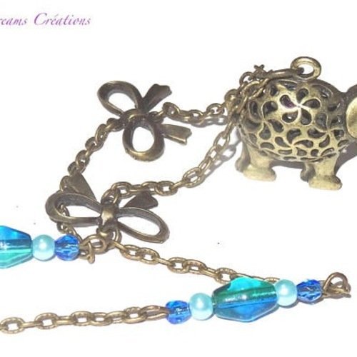 Collier éléphant bronze antique ajouré, noeuds, toupies en verre,perles bleues