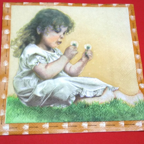 Serviette papier/napkin: enfant  "la petite fille et la fleur de pissenlit" 