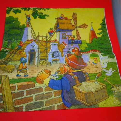 Serviette papier/napkin: enfant  "dans le village de gnomes la construction du château, briques, ciment, truelle, oies" 