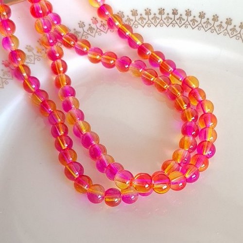 Fil de 130 perles de verre transparent deux couleurs 6 mm orange fushia