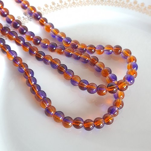 Fil de 130 perles de verre transparent deux couleurs 6 mm violet marron
