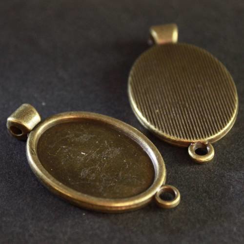 Médaillon  connecteur support cabochon ovale 25 x 18 mm en métal bronze ---