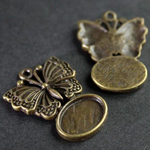 Pendentif papillon support pour cabochon ovale 14 x 10 mm en métal bronze ---