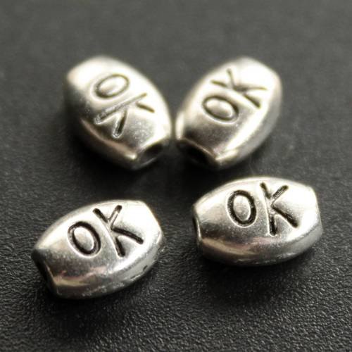 Lot de 10 petites perles intercalaires ovales "ok" en métal argenté 