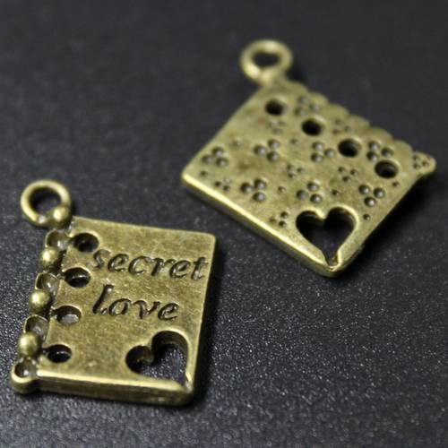 Lot de 2  breloques connecteurs secret love en métal bronze 