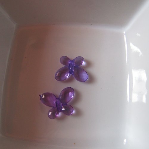 1 perle papillon 18x14mm en plastique transparent