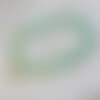 Bracelet en pierres naturelles avec des amazonites et une fleur de cerisier japonaise, l'amazonite est symbole de courage, de paix
