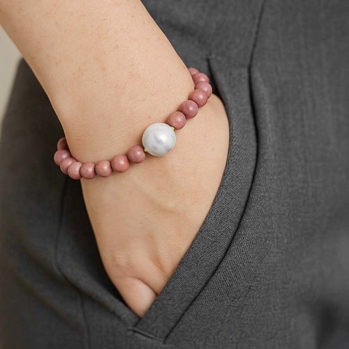 Bracelet de rhodonite avec une adorable perle en céramique