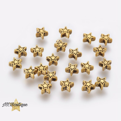 20, 50 perles étoile métal doré 6mm