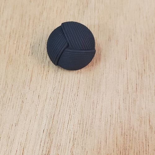 Bouton effet passementerie noir 22 mm