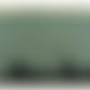 Dentelle de calais noire sur fond vert 15 cm / hauteur de broderie 3 cm, de fabrication française