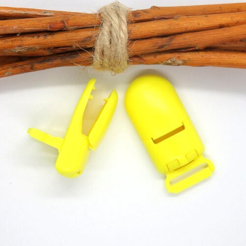 Pince clip/bretelle attache tétine en plastique jaune 40 x 18 mm