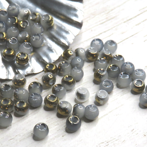 10 perles cristal tonneau grise et dorées 4 mm