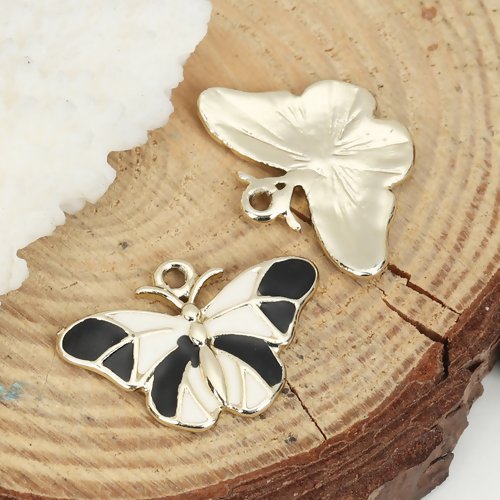 1 breloque pendentif papillon écru et noir - email - métal doré