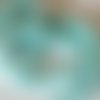 Perle de cristal a facette 6*8 mm couleur vert d eau qui va au bleu