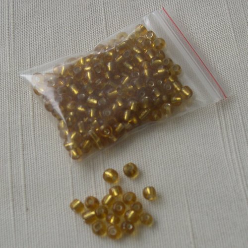 Lot de 10g. de grosses perles de rocaille 4 mm. jaunes moutarde