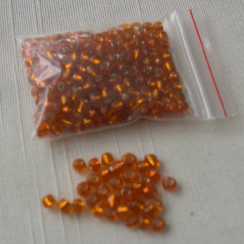 Lot de 10g. de grosses perles de rocaille 4 mm. oranges translucides