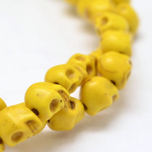10 perles tête de mort jaune 10mm