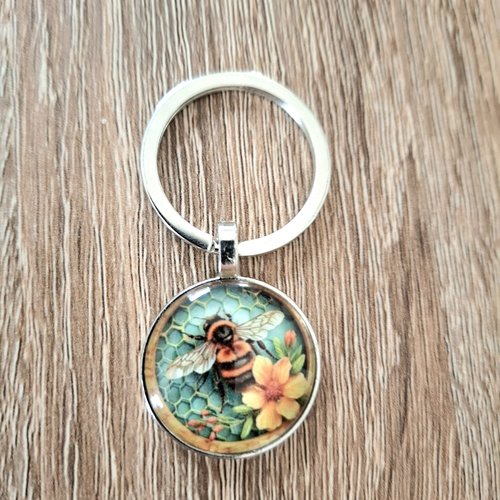 Porte-clés une abeille sur une fleur