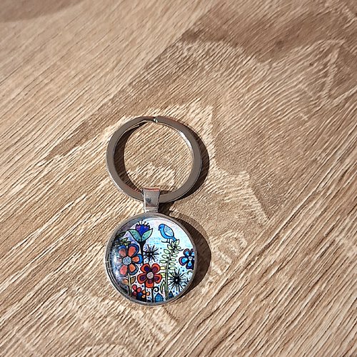 Porte-clés un oiseau sur une fleur