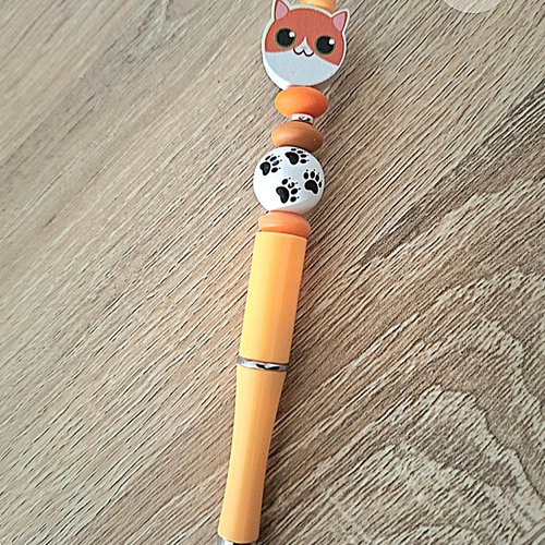 Stylo orange blanc chat