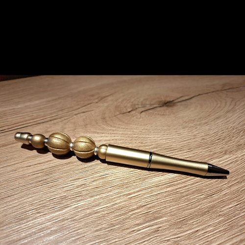 Stylo perles doré