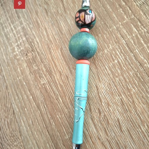 Stylo turquoise et orange