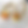 Boucles d'oreilles créoles en acier inoxydable avec pampilles (fleurs) jaune et orange en fimo – faites main & interchangeables