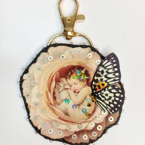 Porte clef "née dans une rose"