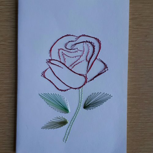 Carte brodée main d'une rose