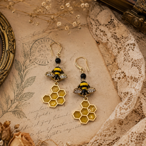 Boucle d'oreille femme insecte abeille nid alvéole ruche protection insecte ruche miel abeille rayée noire jaune aile strass nature fleur