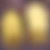 2 perles têtes  de bouddha en howlite  teintée jaune pâle en relief 29x20mm