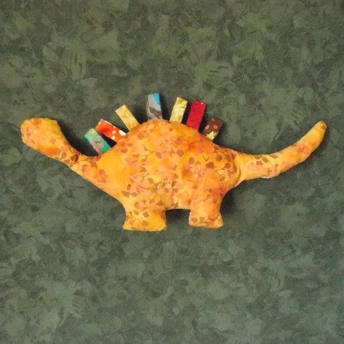 Doudou dinosaure d'aujourd'hui multicolore