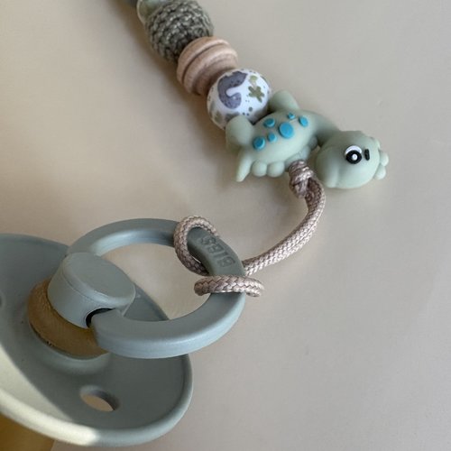 Attache tétine dinosaure