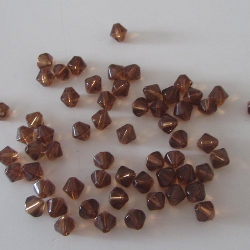 Lot d'environ  60 perles en verre - toupies de couleur marron - dimension : 7 mm x 5 mm