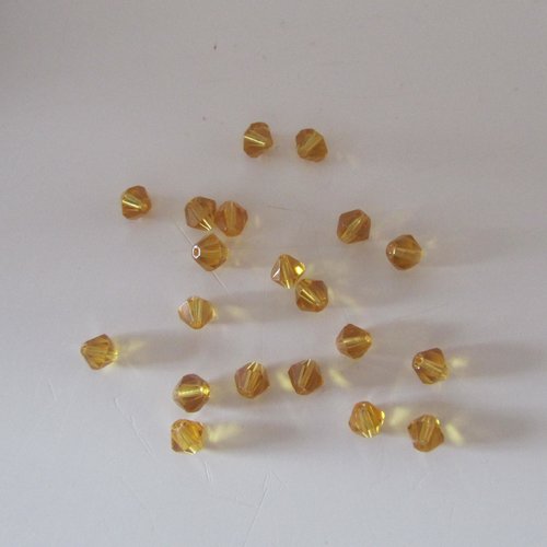 Lot de 20 perles en verre - toupies - de couleur jaune foncé