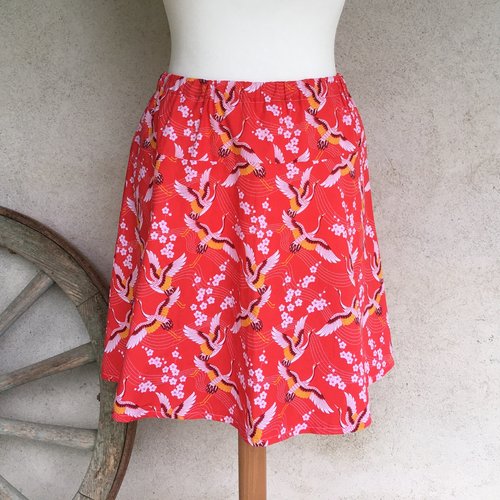 Jupe trapèze ample taille élastique en tissu coton imprimé oiseaux et fleurs de cerisiers sur fond orange