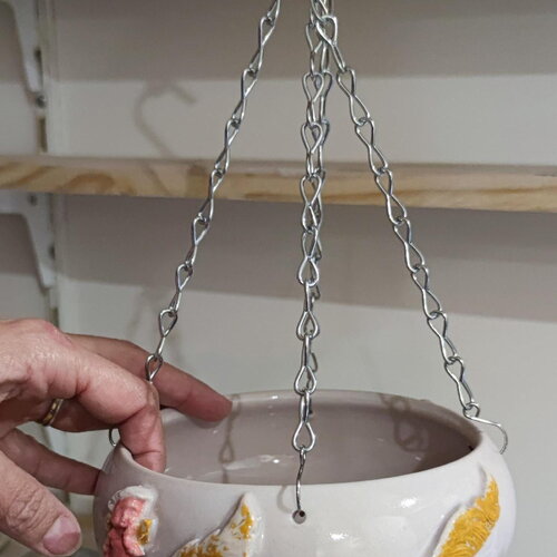 Cache pot plume et petit ange- porte bonheur