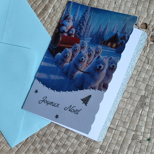 Carte joyeux noël bleue glacier avec des chiens samoyèdes père noël