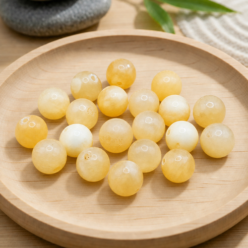 Perles rondes en calcite jaune naturelle