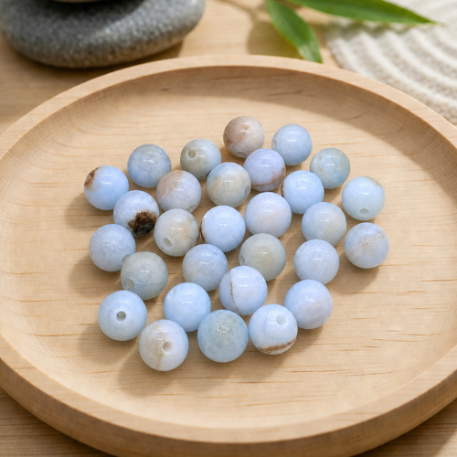 Perles rondes en calcédoine bleue