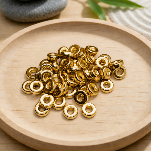 Perles intercalaires donut 6mm en ccb doré – lot de 50