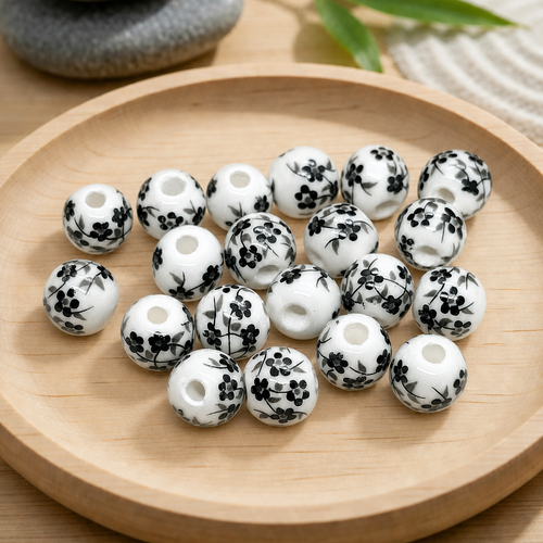 Perles rondes en céramique blanche motif floral noir 8mm par 20