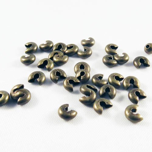 Cpe17b - lot de 50 cache perles noeuds à écraser en fer de couleur bronze antique de 3mm 