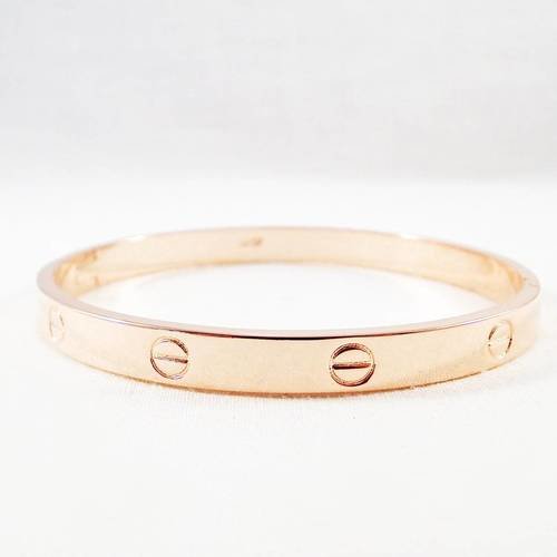 Magnifique support bracelet inspiration luxe de couleur plaqué or rose motifs griffe clou 