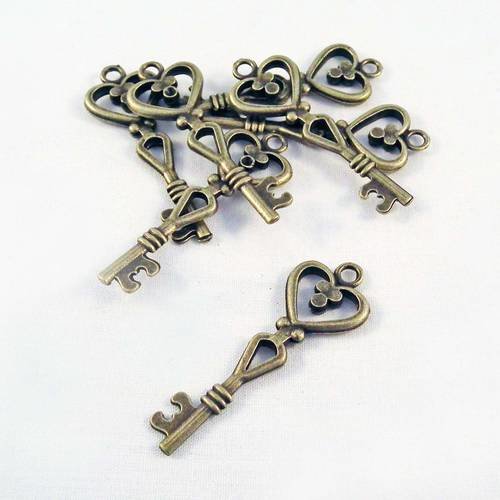 Bcc03 - 1 breloque pendentif clés clef vintage motif coeur pois de couleur bronze 