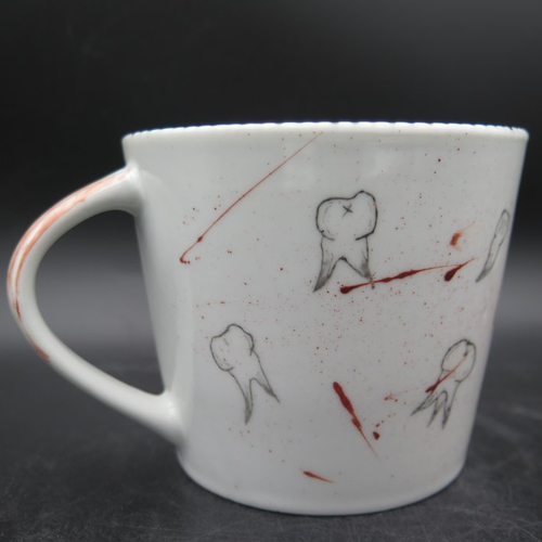 La tasse de l'arracheur de dents